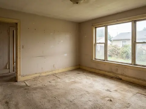 Before: Dingy room with scuffed walls