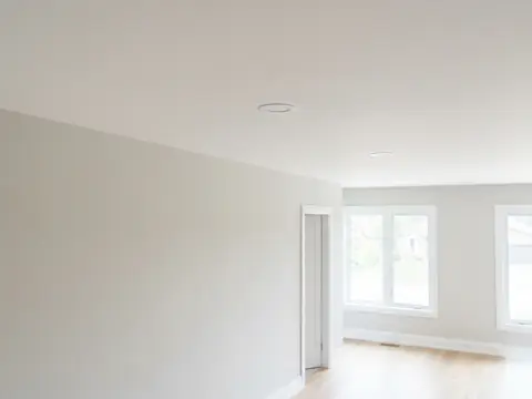 After: Smooth white ceiling in a bright room
